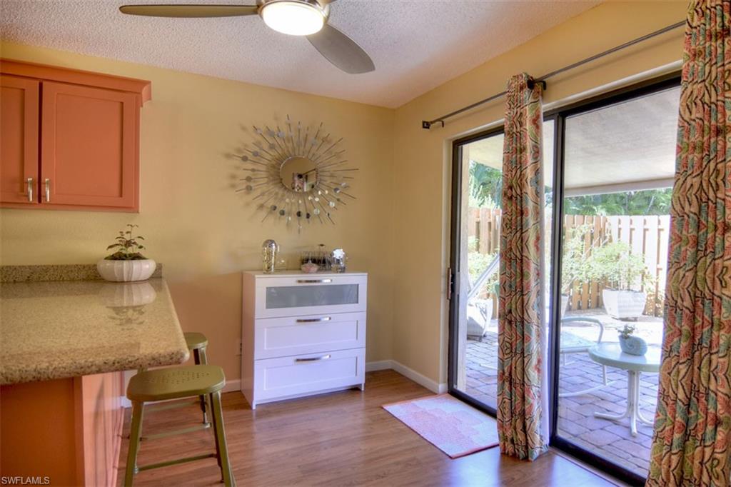 1468 Park Shore Circle, Unit 4 Fort Myers, FL 33901 - Photo 10 of 32 a room with cabinets and wooden floor