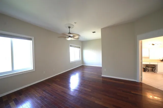 a bathroom with a double vanity sink a mirror and a bathtub
