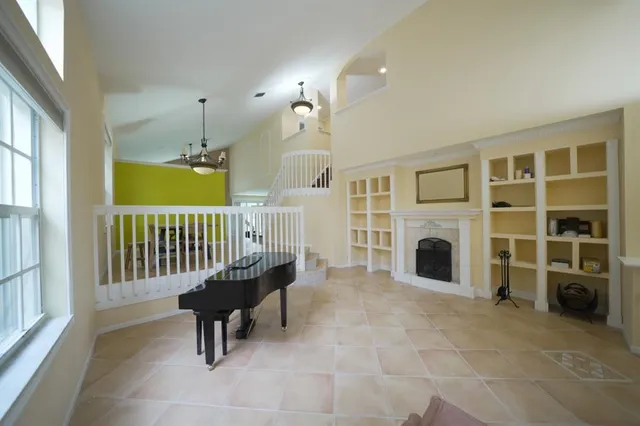 a view of a livingroom with furniture and staircase