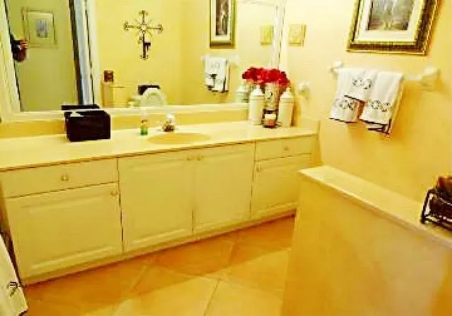 a bathroom with a sink and a mirror