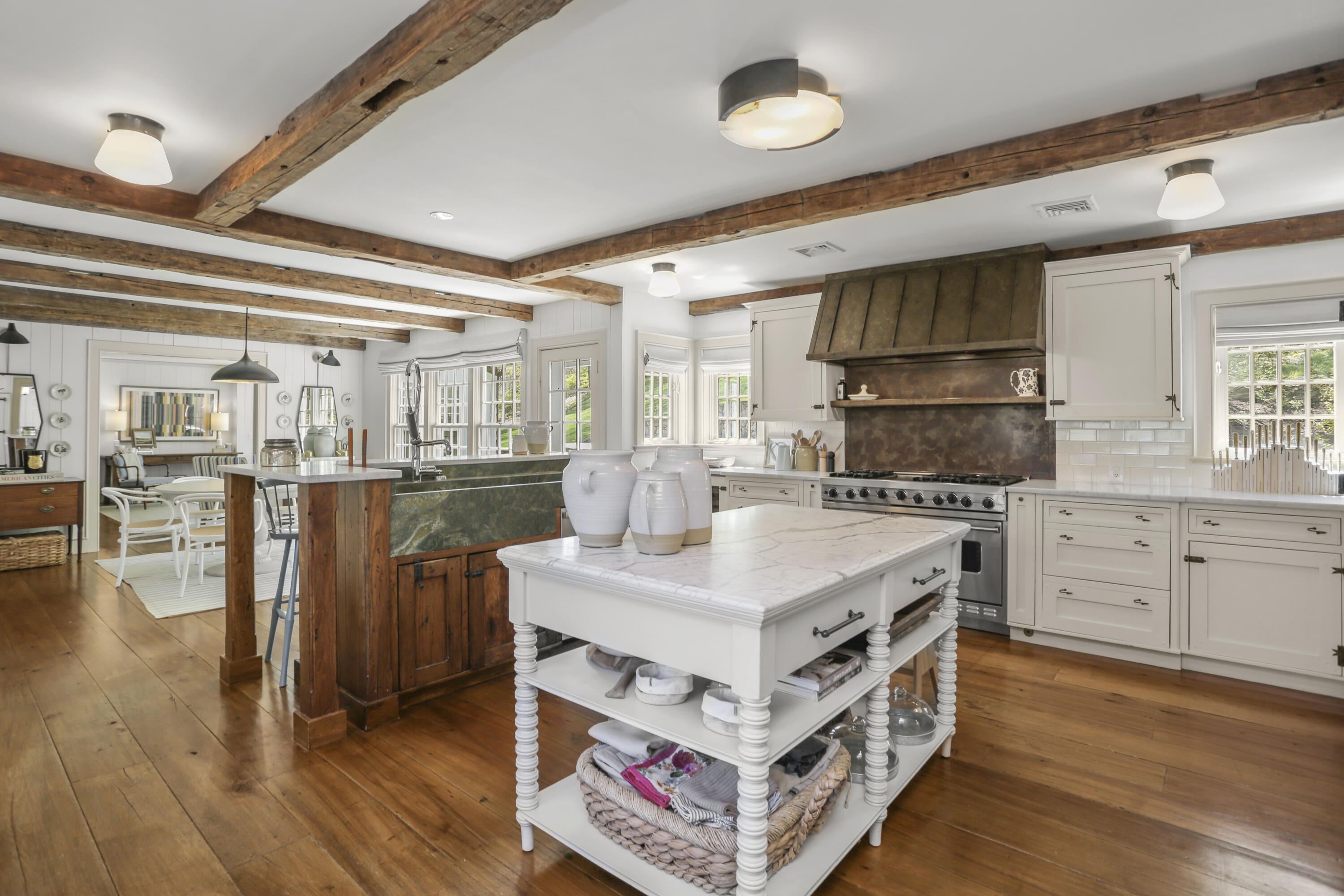 215 Cross Ridge Road New Canaan, CT 06840 - Photo 11 of 50 a kitchen with a stove cabinets and wooden floor