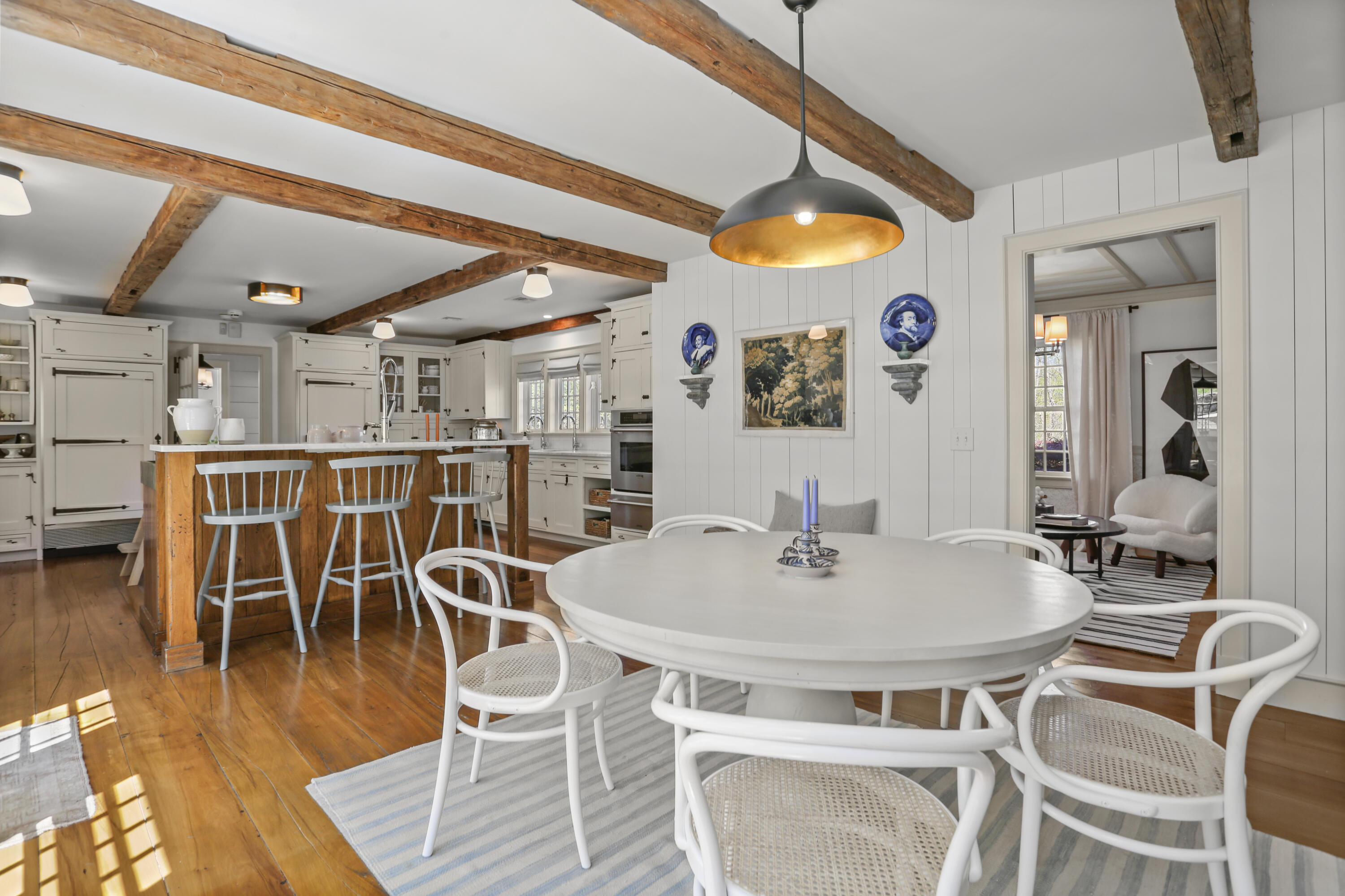 215 Cross Ridge Road New Canaan, CT 06840 - Photo 12 of 50 a dining room with furniture and wooden floor