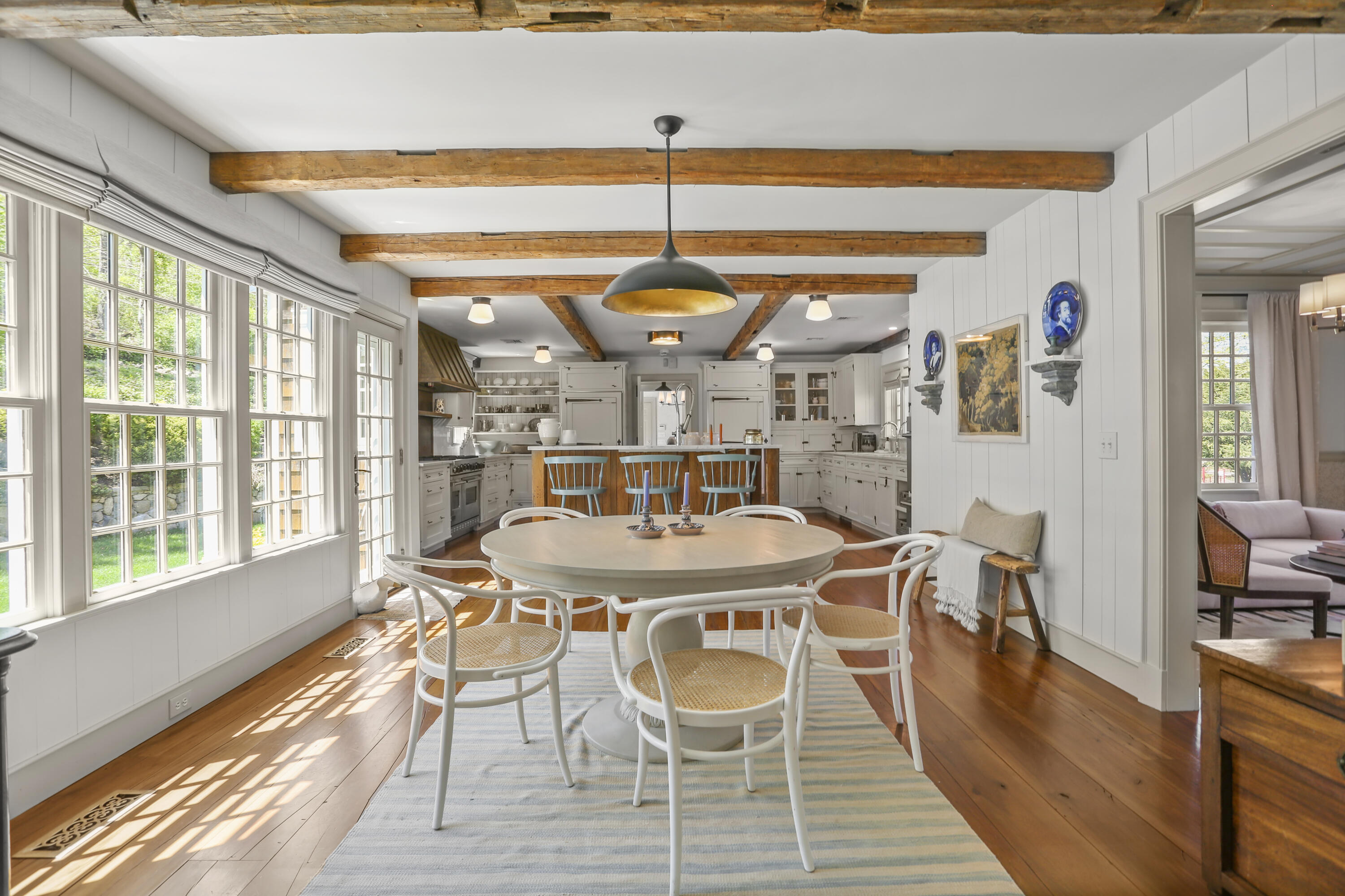 215 Cross Ridge Road New Canaan, CT 06840 - Photo 13 of 50 a view of a dining room with furniture window and wooden floor