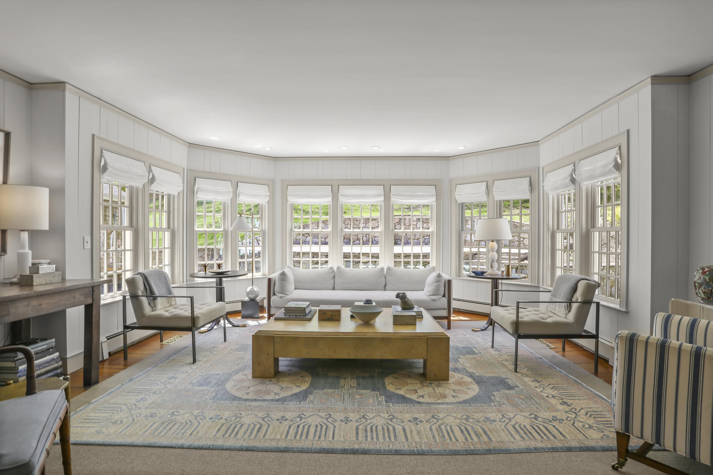 215 Cross Ridge Road New Canaan, CT 06840 - Photo 15 of 50 a living room with furniture and a floor to ceiling window