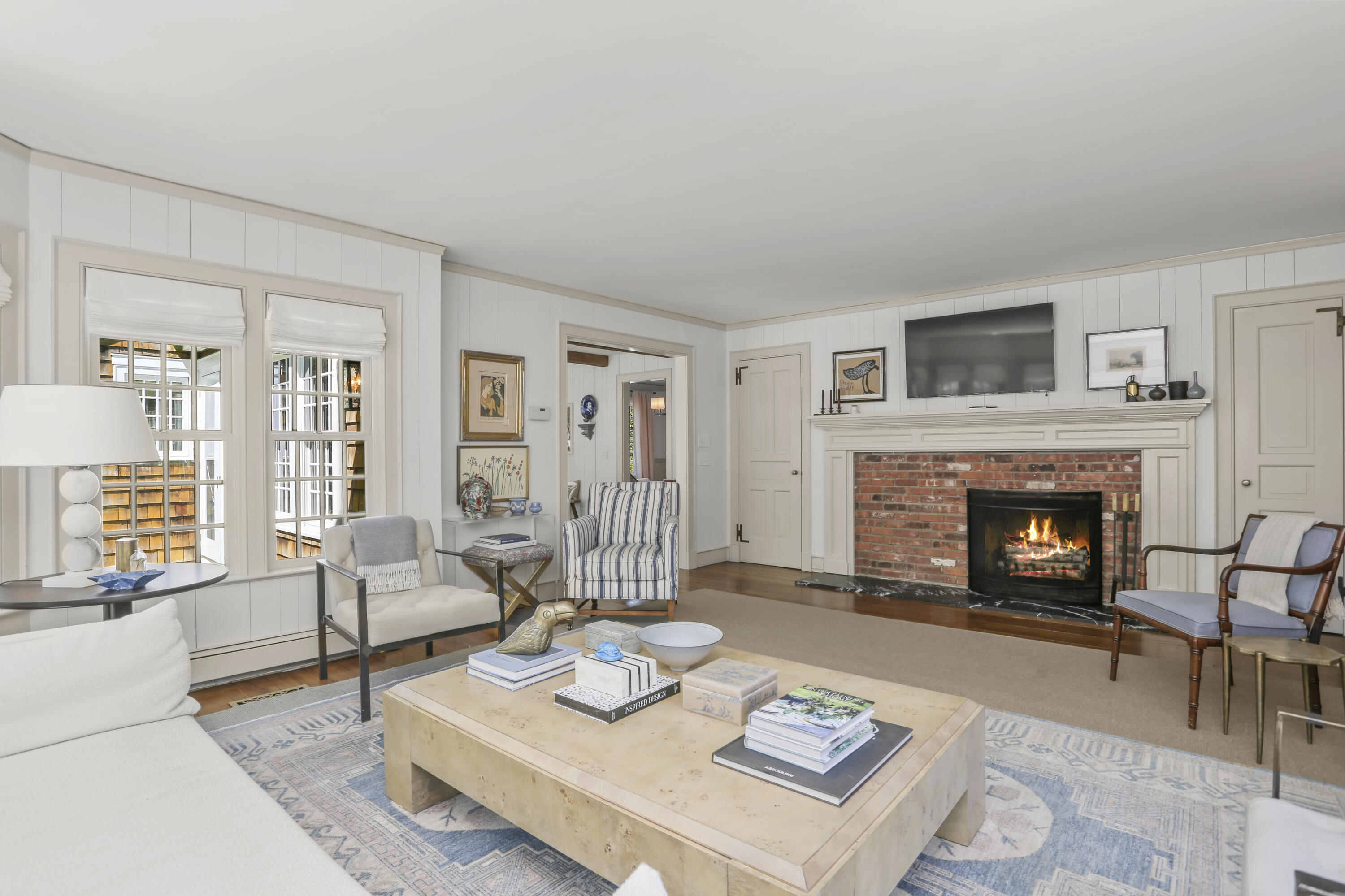 215 Cross Ridge Road New Canaan, CT 06840 - Photo 16 of 50 a living room with furniture and a fireplace