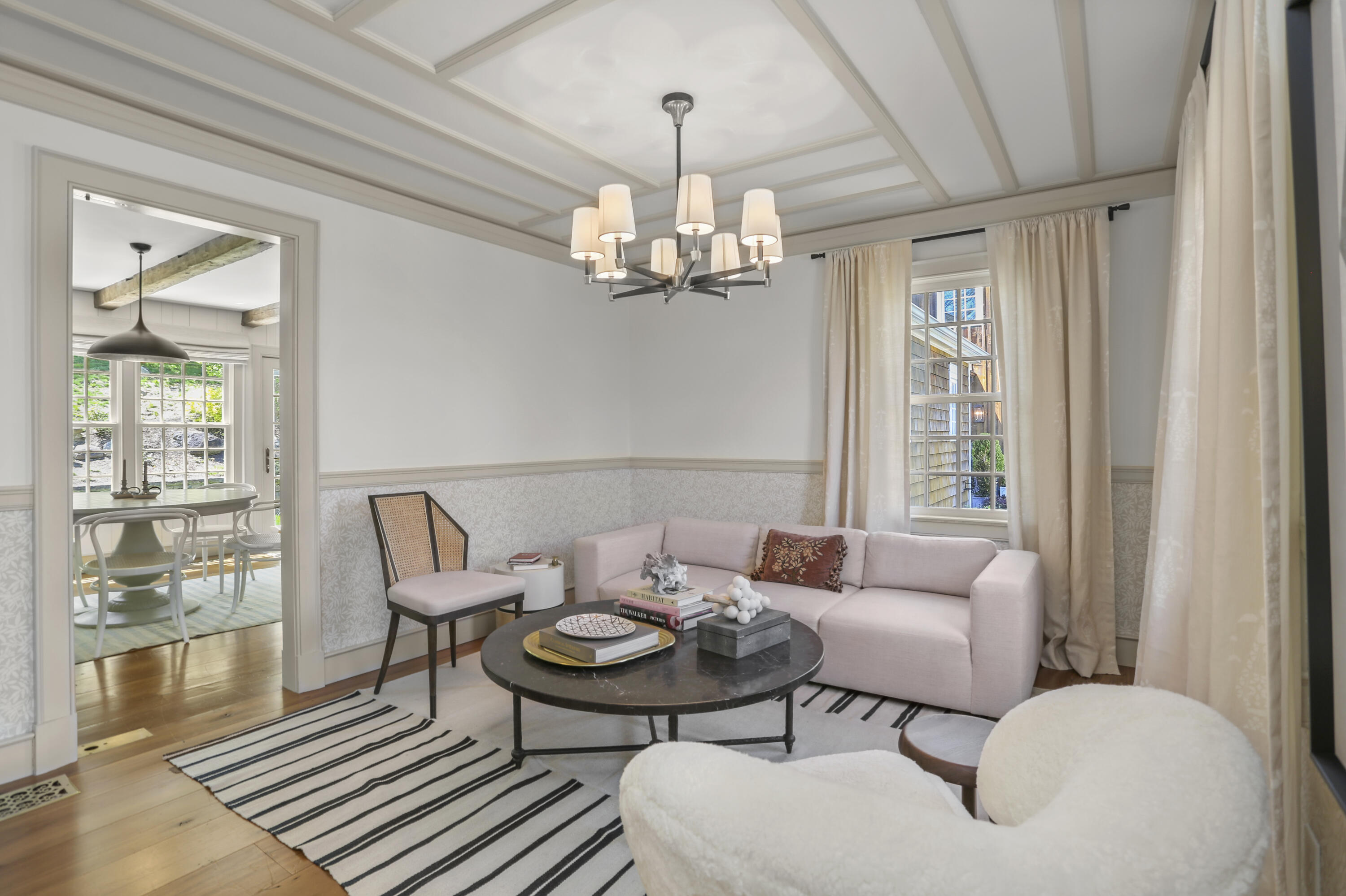 215 Cross Ridge Road New Canaan, CT 06840 - Photo 17 of 50 a living room with furniture a chandelier and a window
