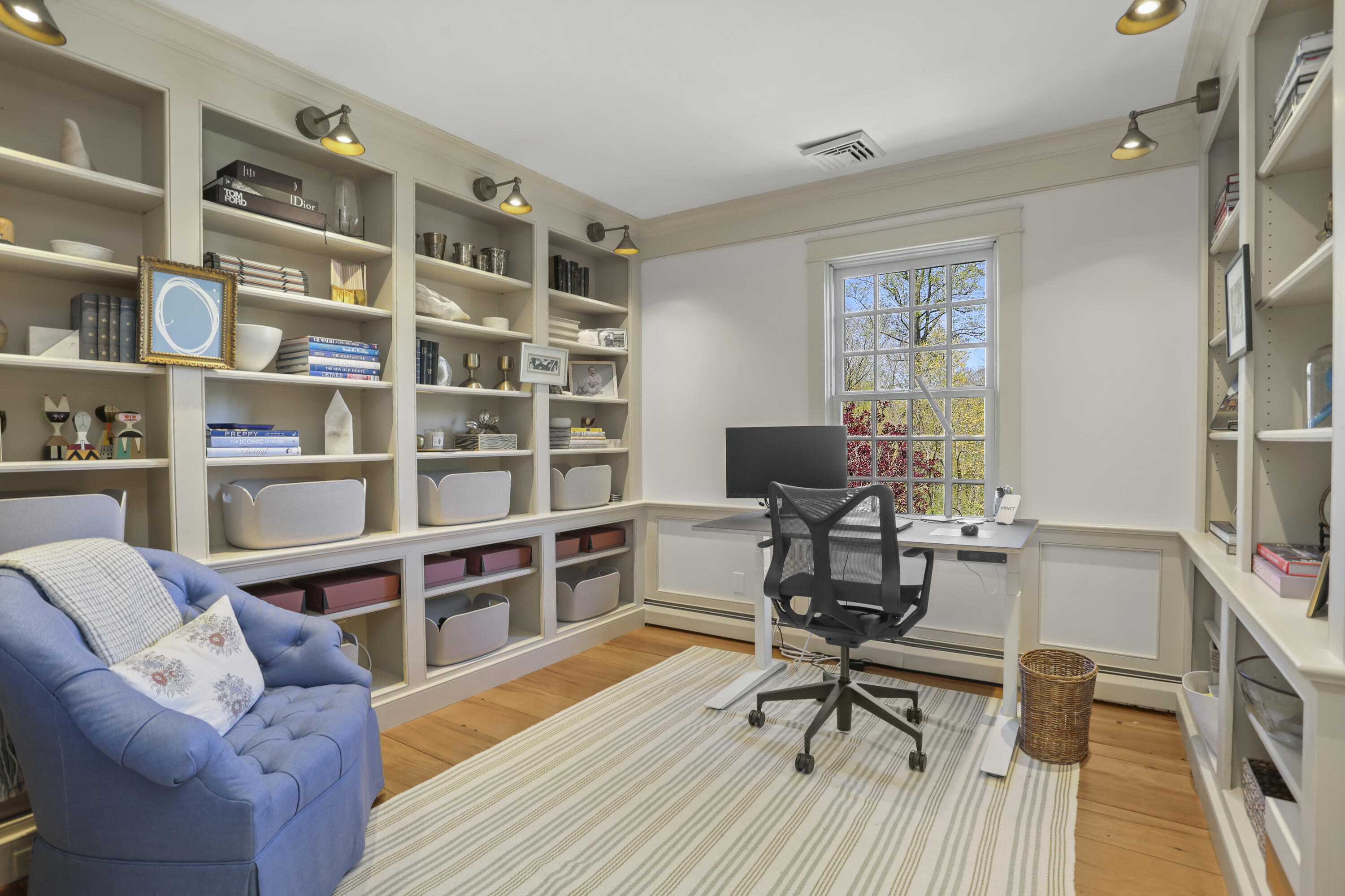 215 Cross Ridge Road New Canaan, CT 06840 - Photo 20 of 50 a view of a workspace with furniture and a bookshelf