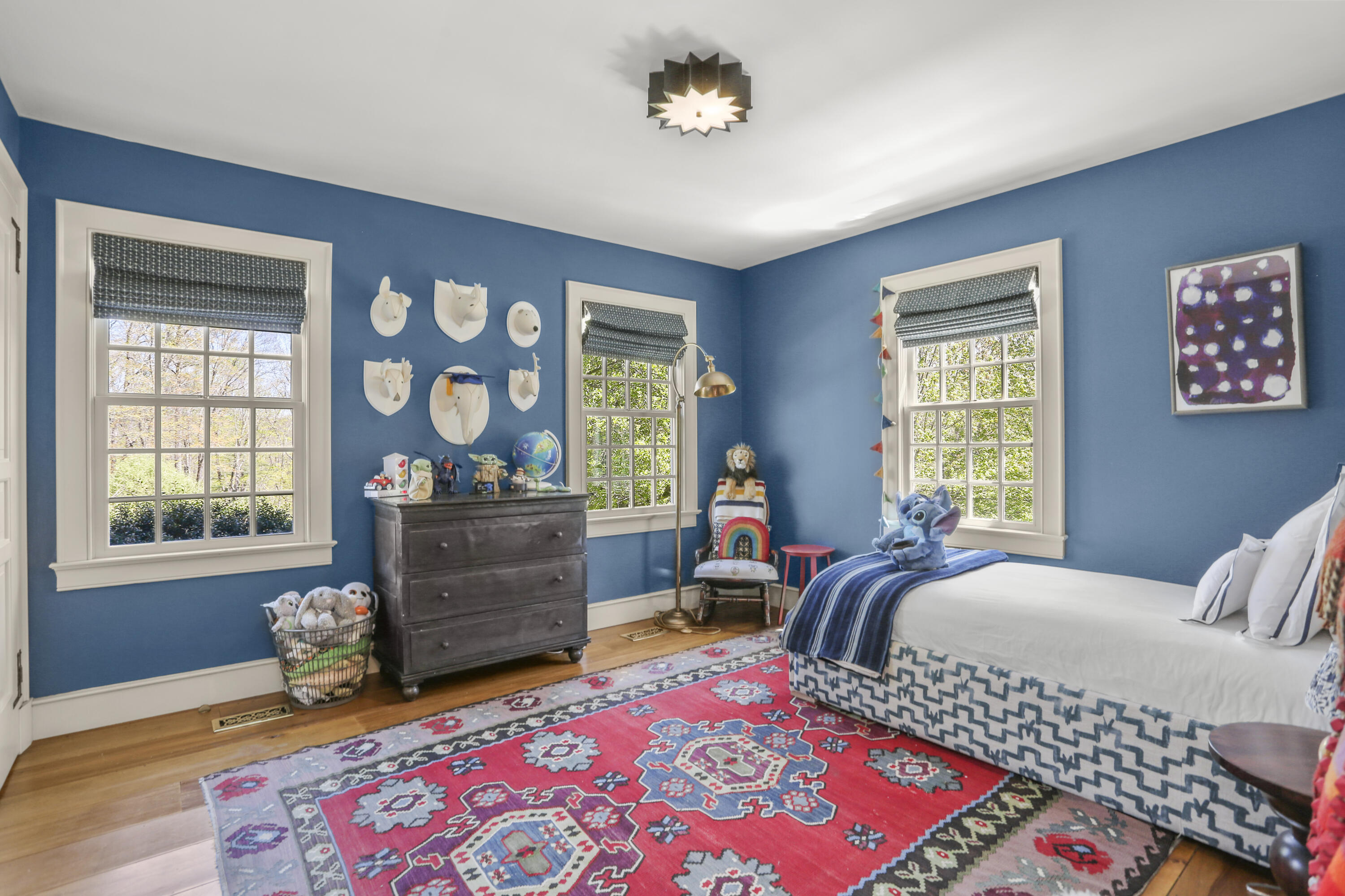 215 Cross Ridge Road New Canaan, CT 06840 - Photo 21 of 50 a bedroom with a bed and windows