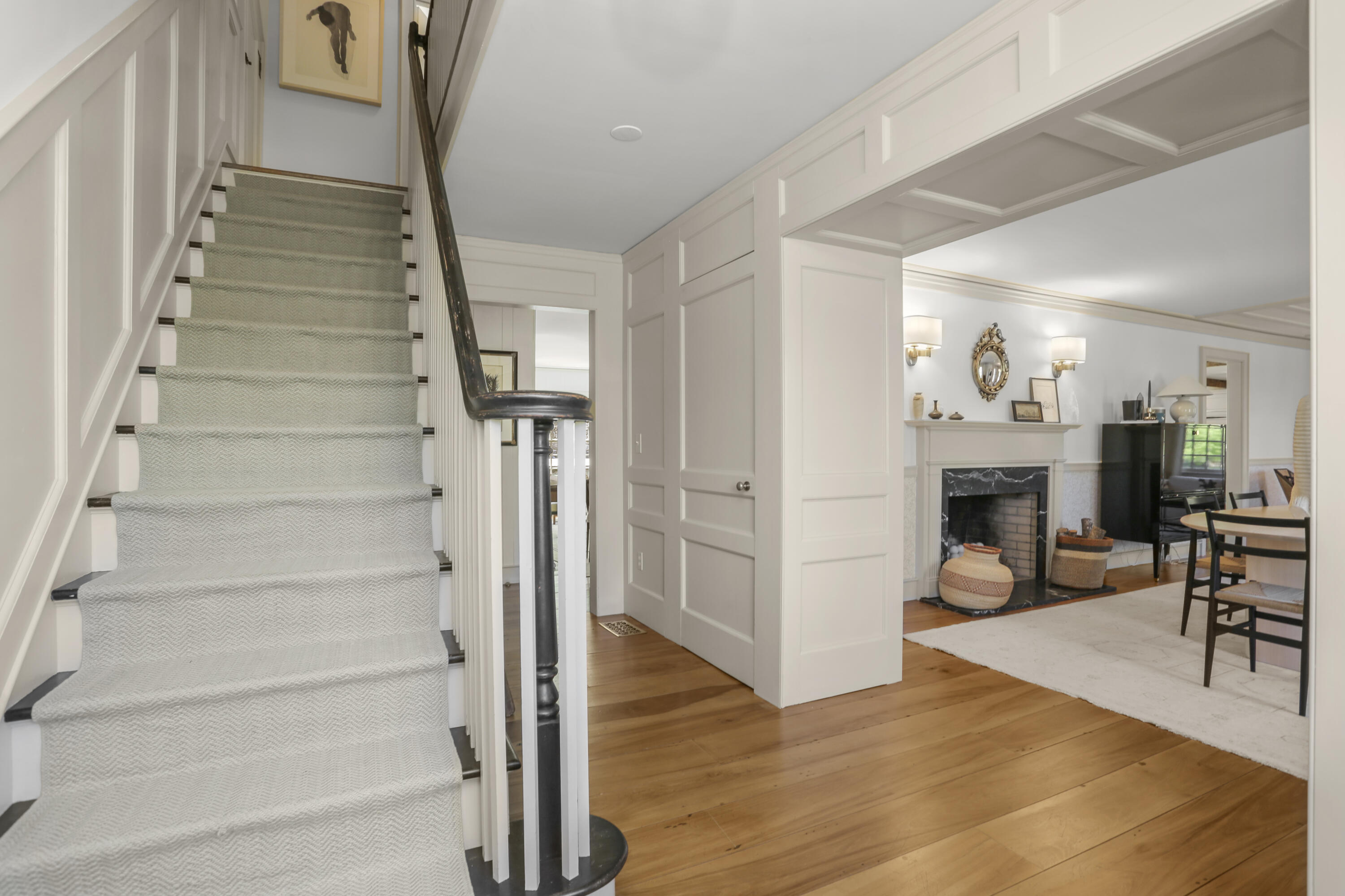 215 Cross Ridge Road New Canaan, CT 06840 - Photo 30 of 50 a view of a livingroom with wooden floor and a fireplace