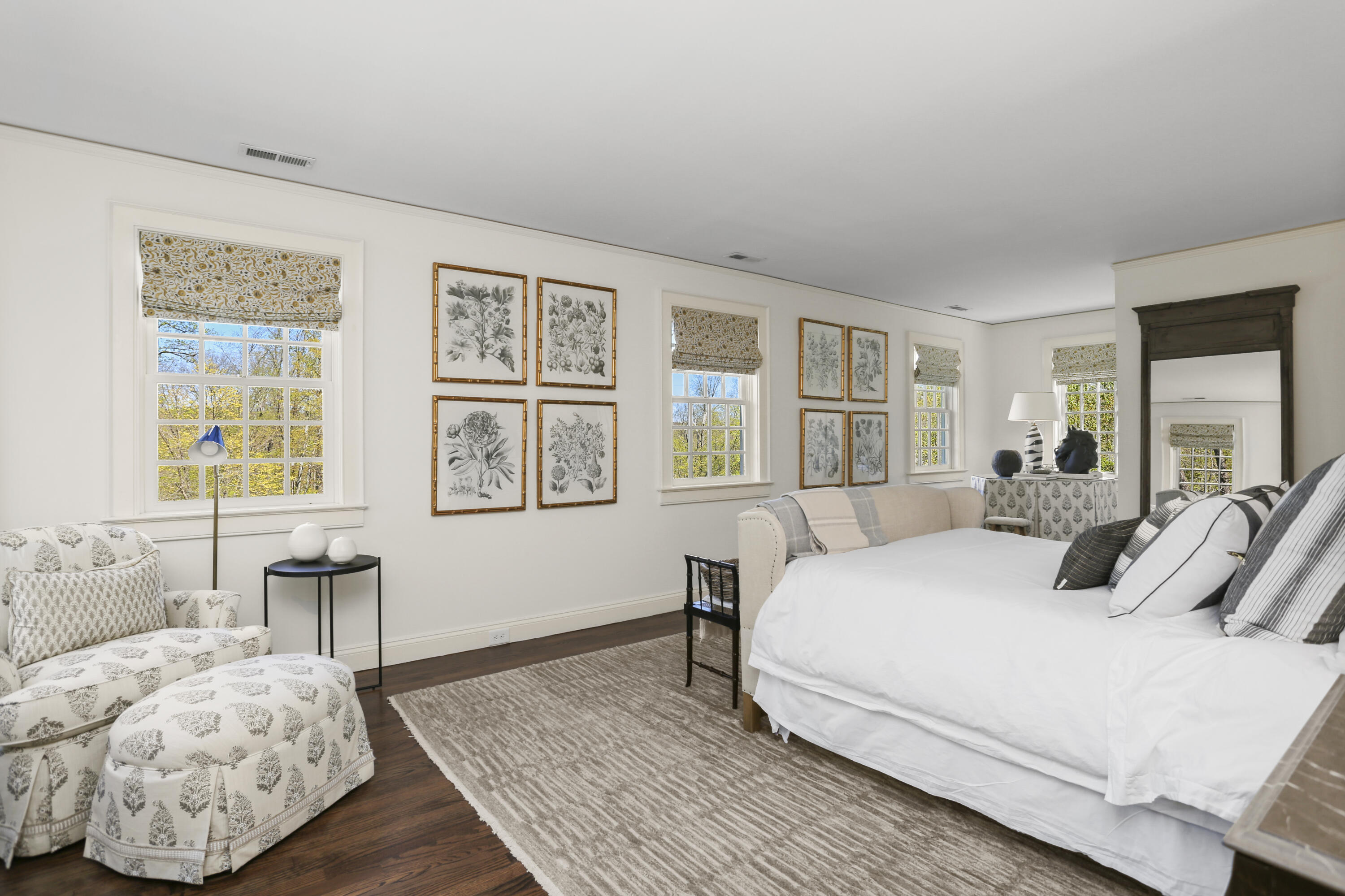 215 Cross Ridge Road New Canaan, CT 06840 - Photo 33 of 50 a bedroom with a large bed and wooden floor