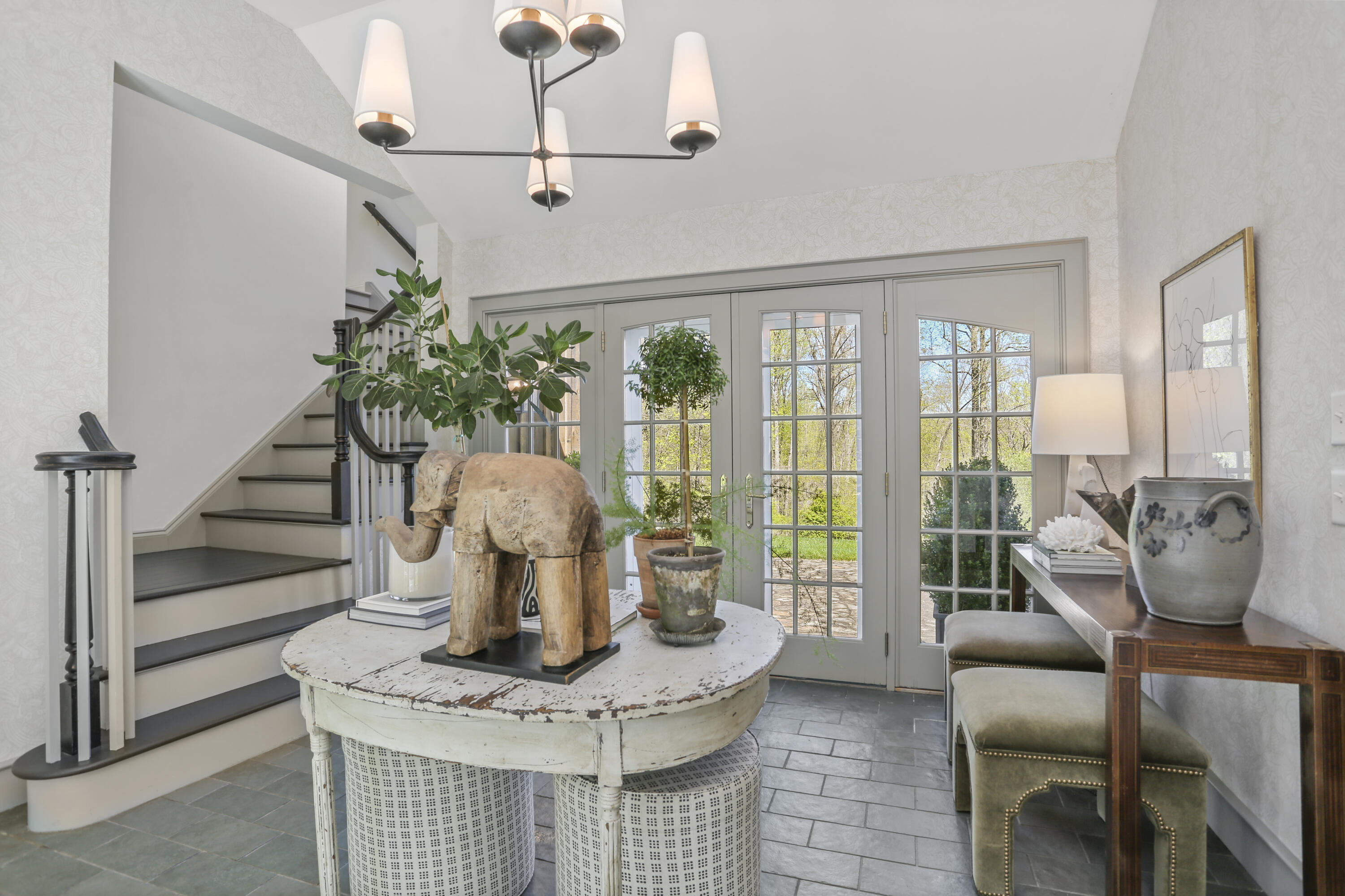 215 Cross Ridge Road New Canaan, CT 06840 - Photo 36 of 50 a view of a dining room with furniture wooden floor and chandelier
