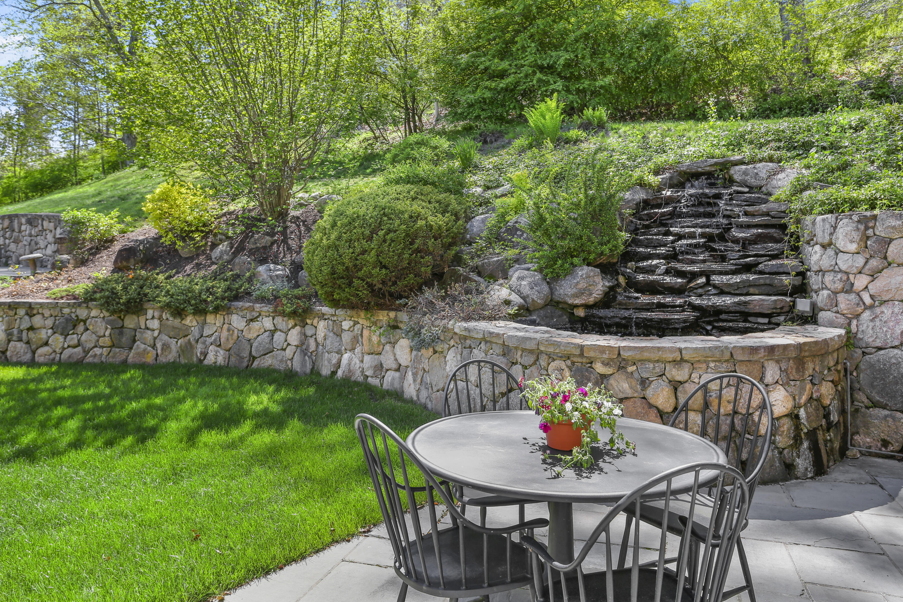 215 Cross Ridge Road New Canaan, CT 06840 - Photo 41 of 50 a table and chairs in the patio