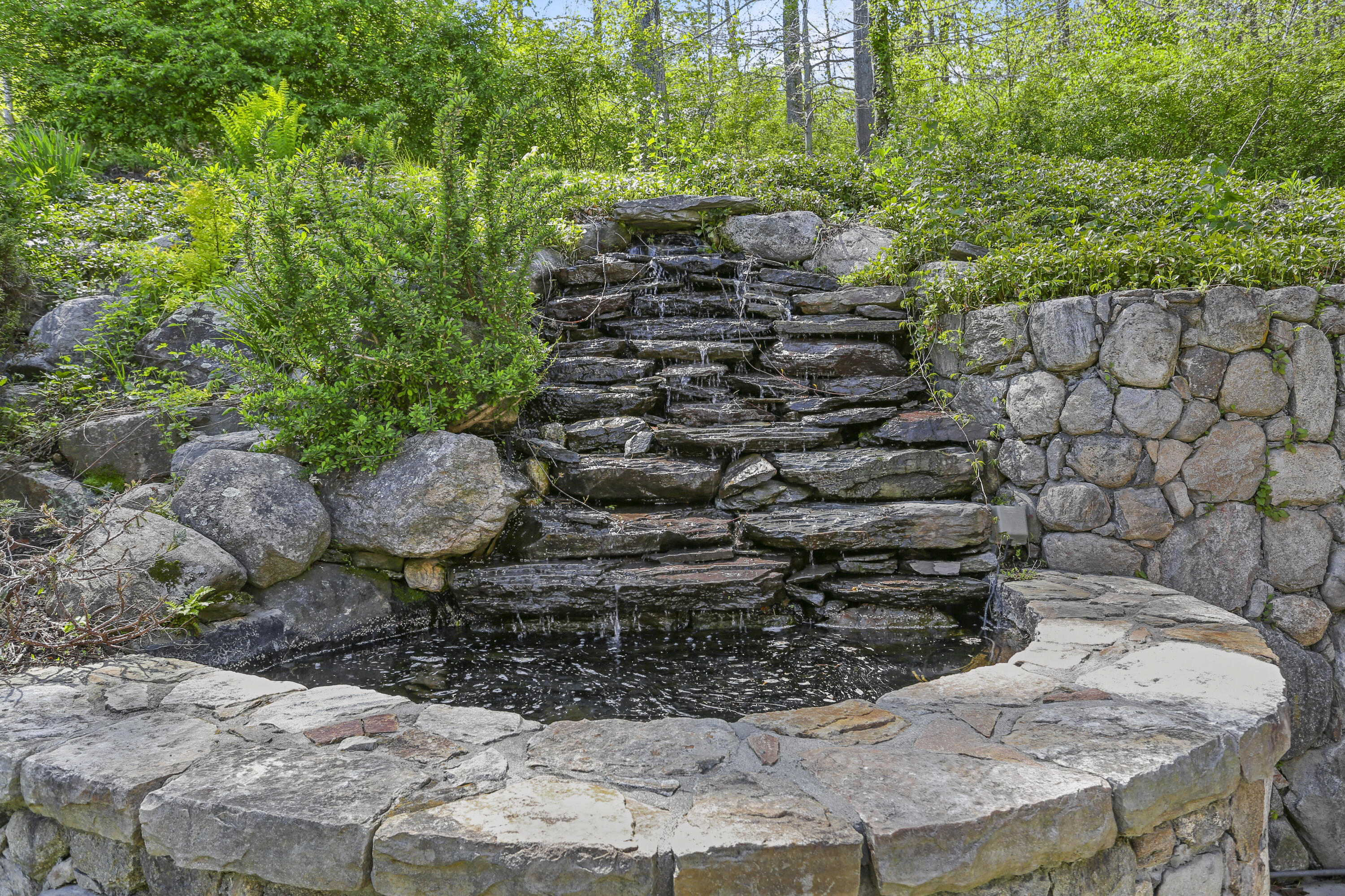 215 Cross Ridge Road New Canaan, CT 06840 - Photo 42 of 50 a view of a wooden house with a yard