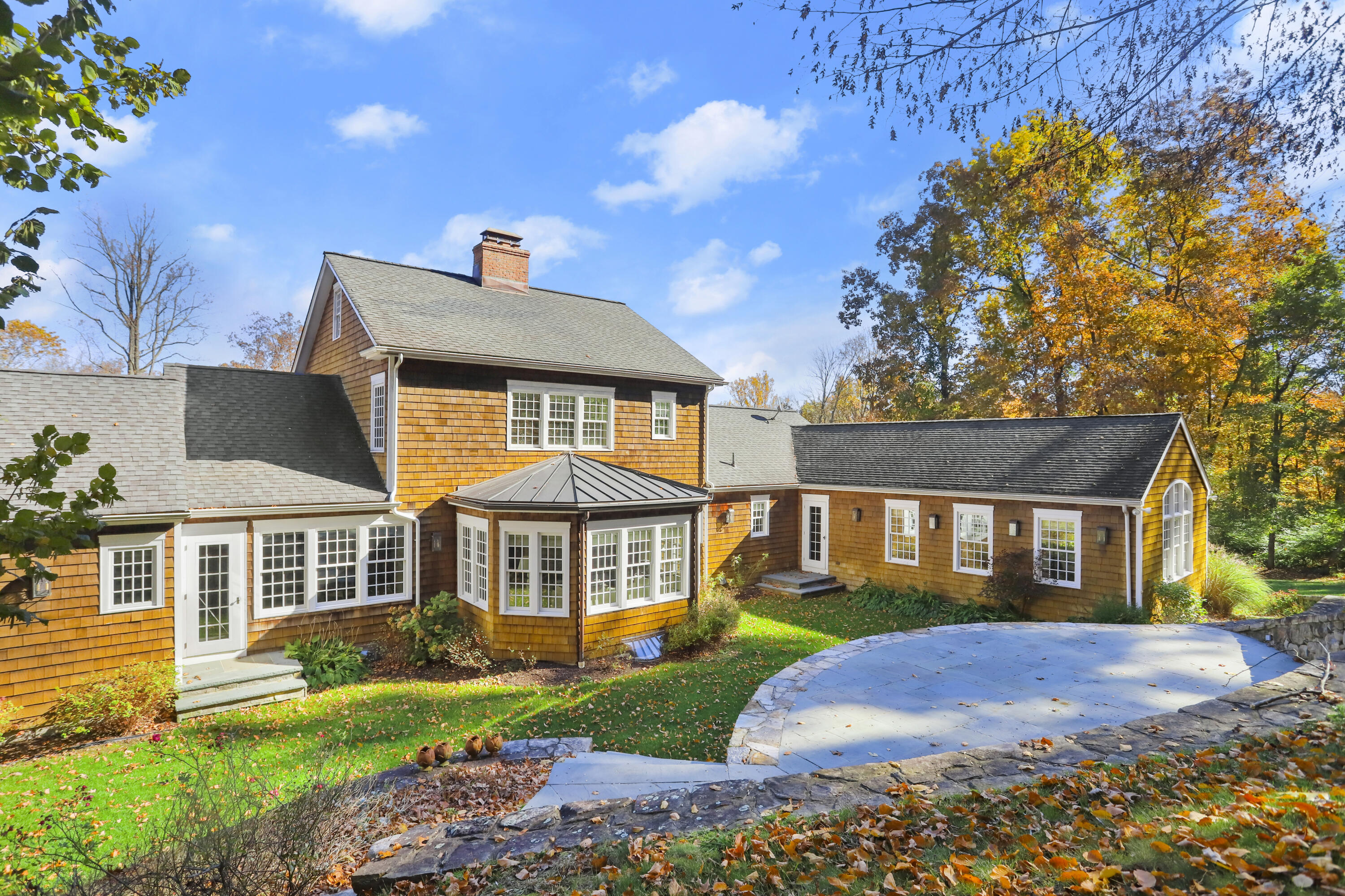 215 Cross Ridge Road New Canaan, CT 06840 - Photo 43 of 50 a front view of a house with a yard