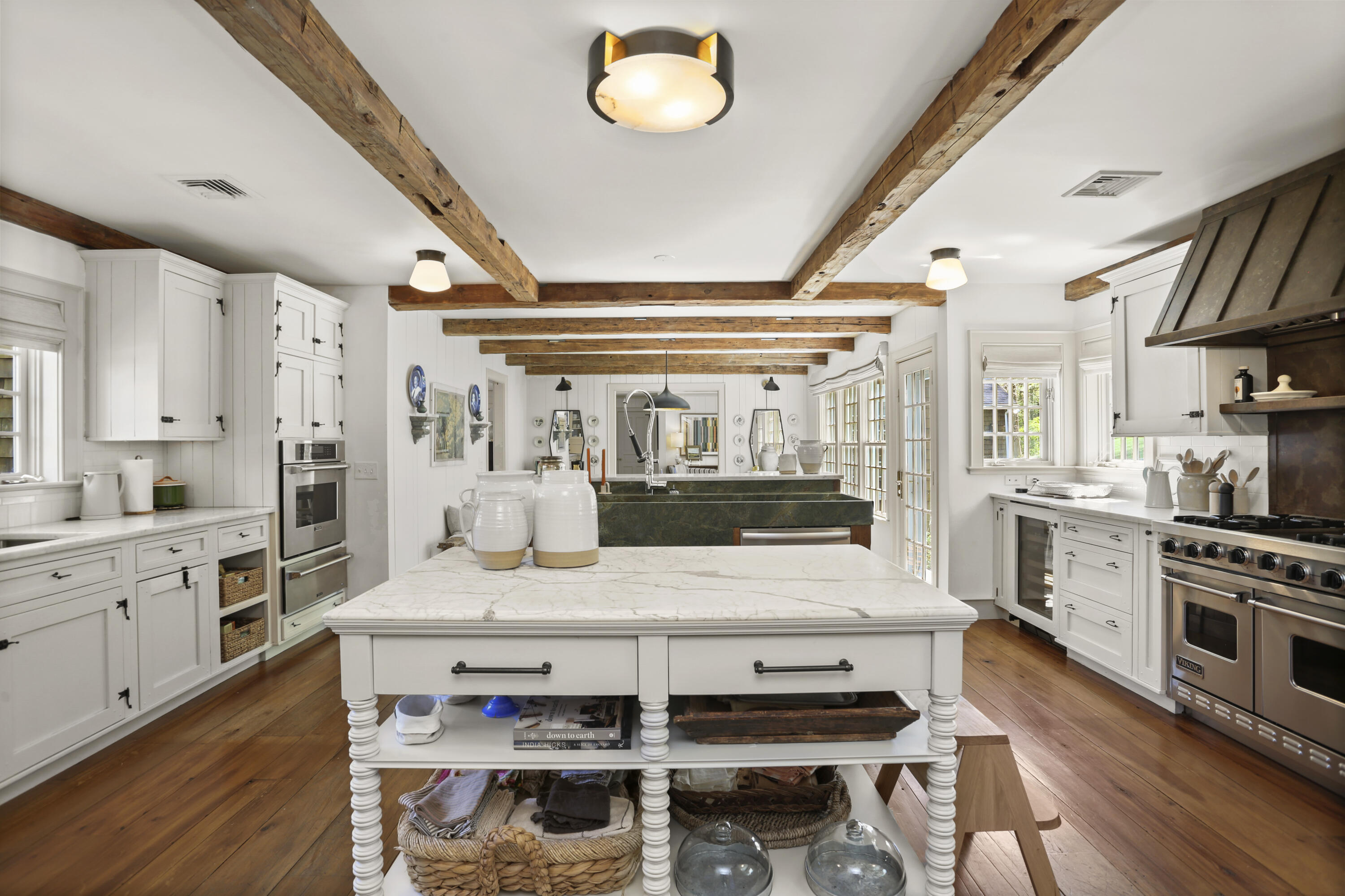 215 Cross Ridge Road New Canaan, CT 06840 - Photo 7 of 50 a kitchen with a table chairs stove and cabinets
