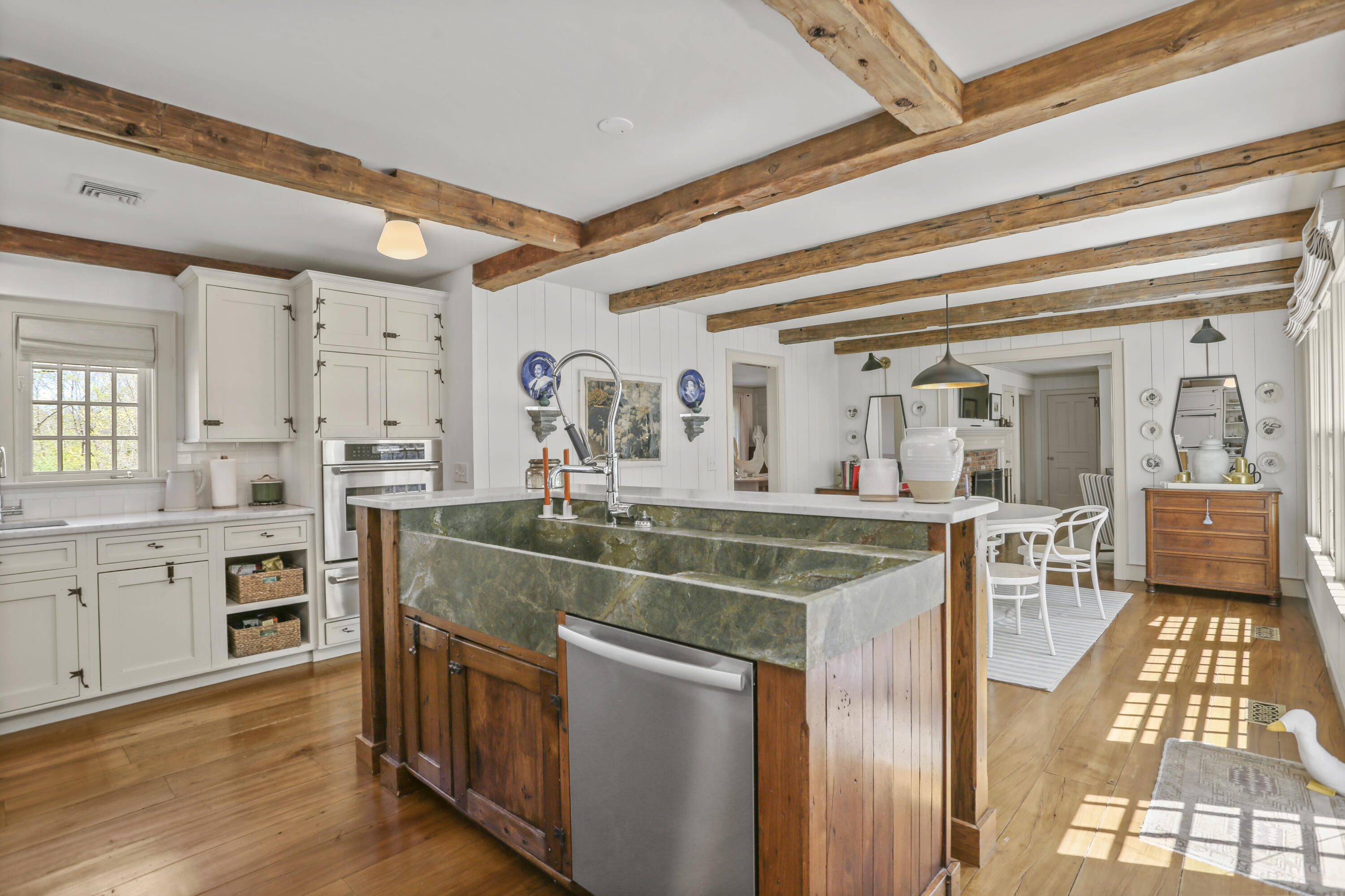 215 Cross Ridge Road New Canaan, CT 06840 - Photo 8 of 50 a view of living room kitchen with stainless steel appliances granite countertop cabinets and window