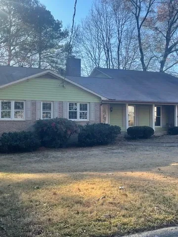 a house view with a garden space