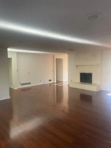 a view of a livingroom with wooden floor