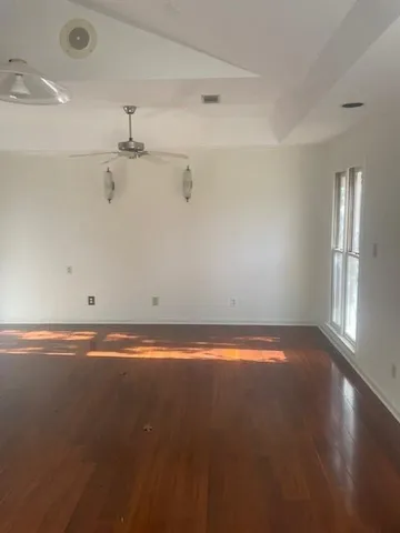 an empty room with an empty space and a window