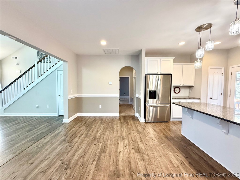 107 Judiciary Court Cameron, NC 28326 - Photo 7 of 49 a view of a kitchen with wooden floor and electronic appliances
