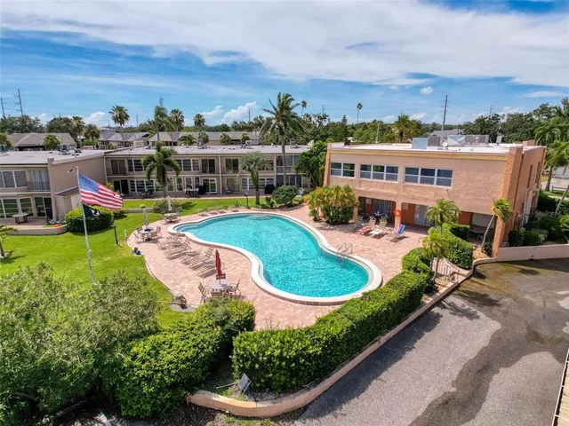 an aerial view of a house with outdoor space patio and swimming pool