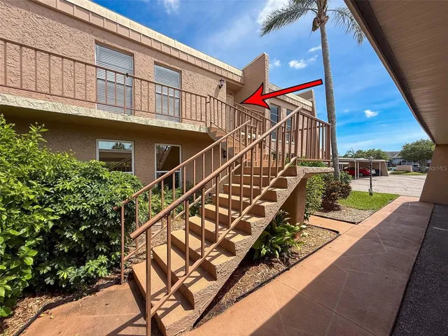 a view of swimming pool with a balcony