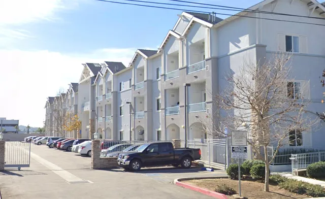 a front view of a building with street view