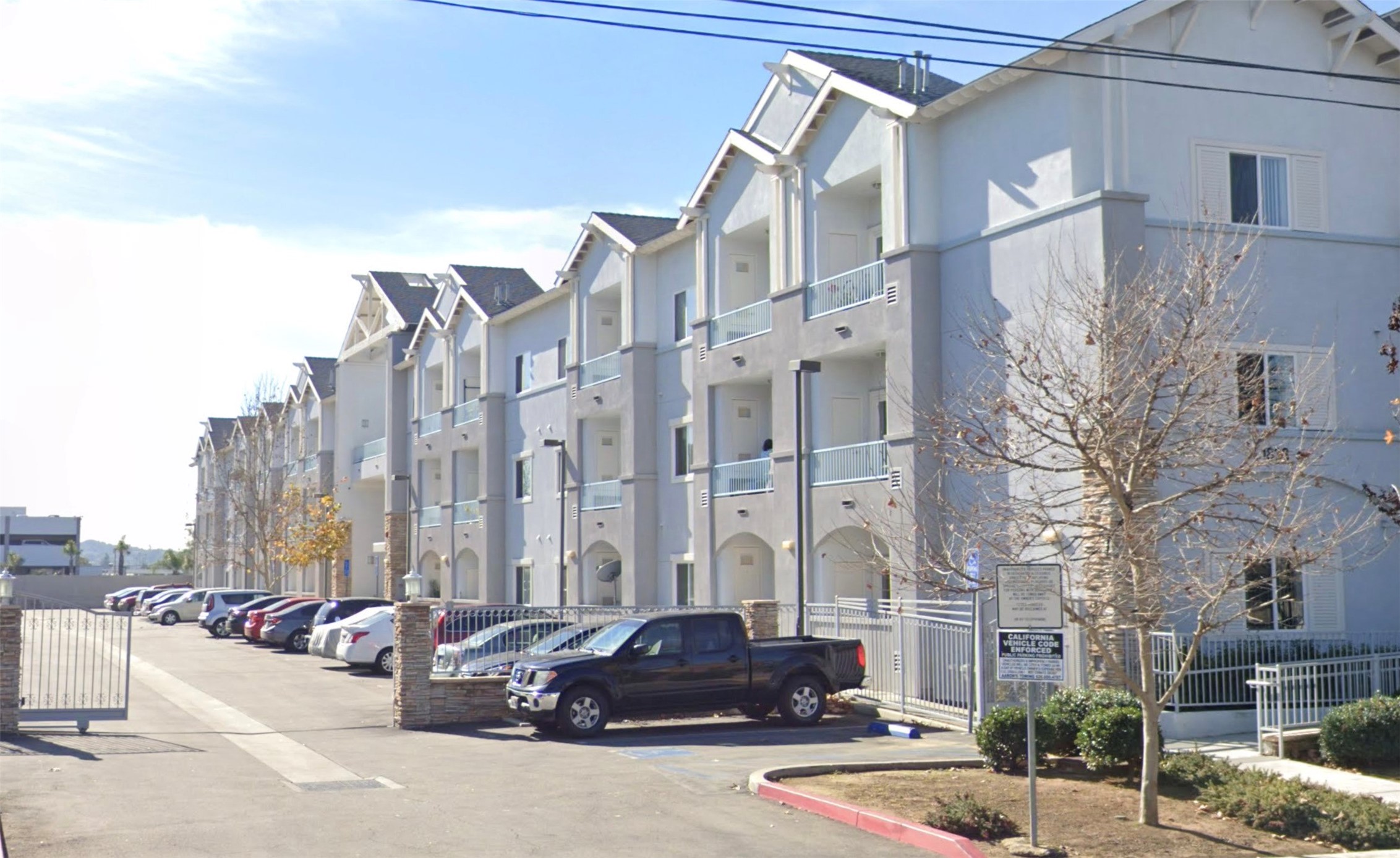a front view of a building with street view