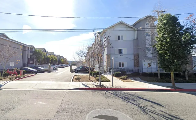 a view of a building with a street