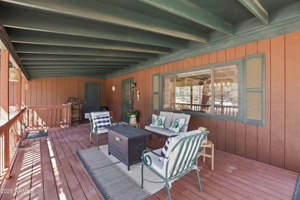 a view of a patio with wooden floor