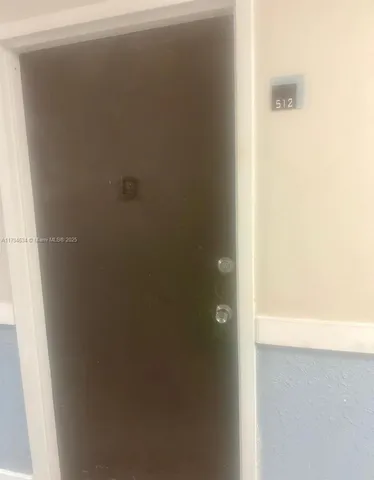 a living room with furniture and a mirror