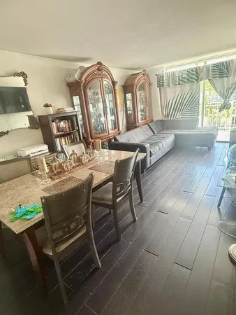 a kitchen with stainless steel appliances granite countertop a stove and a microwave