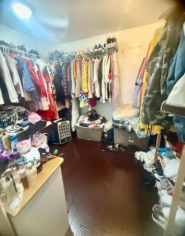 a bedroom with double bed and a night stand