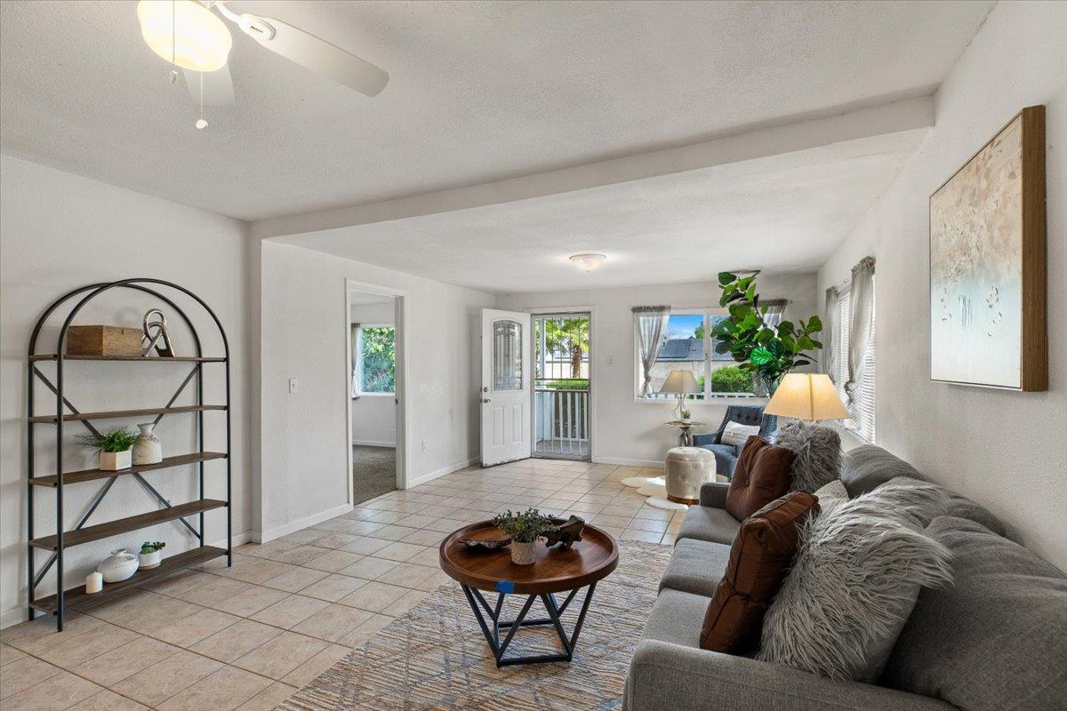 572 Pedersen Road Oakdale, CA 95361 - Photo 10 of 36 a living room with furniture a window and a potted plant