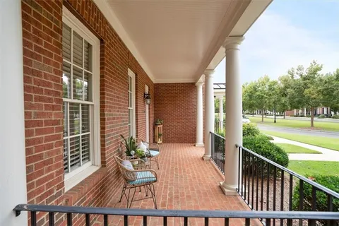 a view of a porch with wooden floor