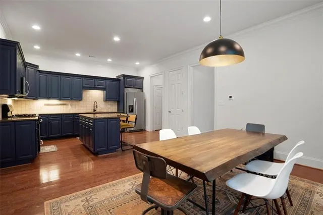 a kitchen with a table and chairs in it