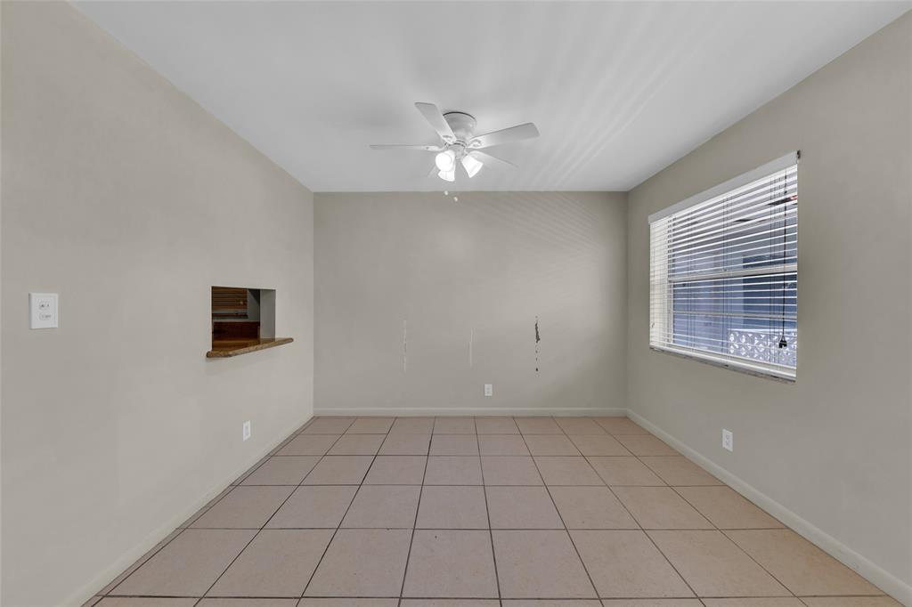 2201 Northeast 36th Street, Unit 205 Lighthouse Point, FL 33064 - Photo 11 of 40 a view of an empty room with a window