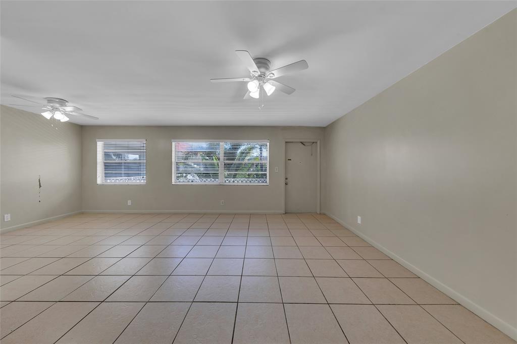 2201 Northeast 36th Street, Unit 205 Lighthouse Point, FL 33064 - Photo 15 of 40 a view of an empty room with a window
