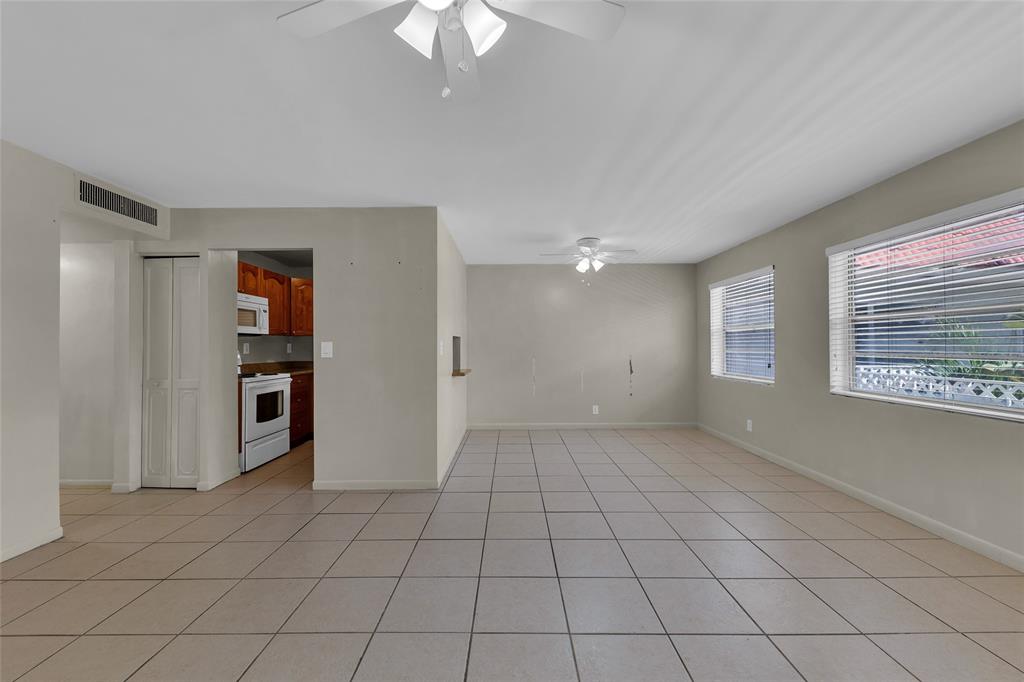 2201 Northeast 36th Street, Unit 205 Lighthouse Point, FL 33064 - Photo 17 of 40 a view of an empty room with a window