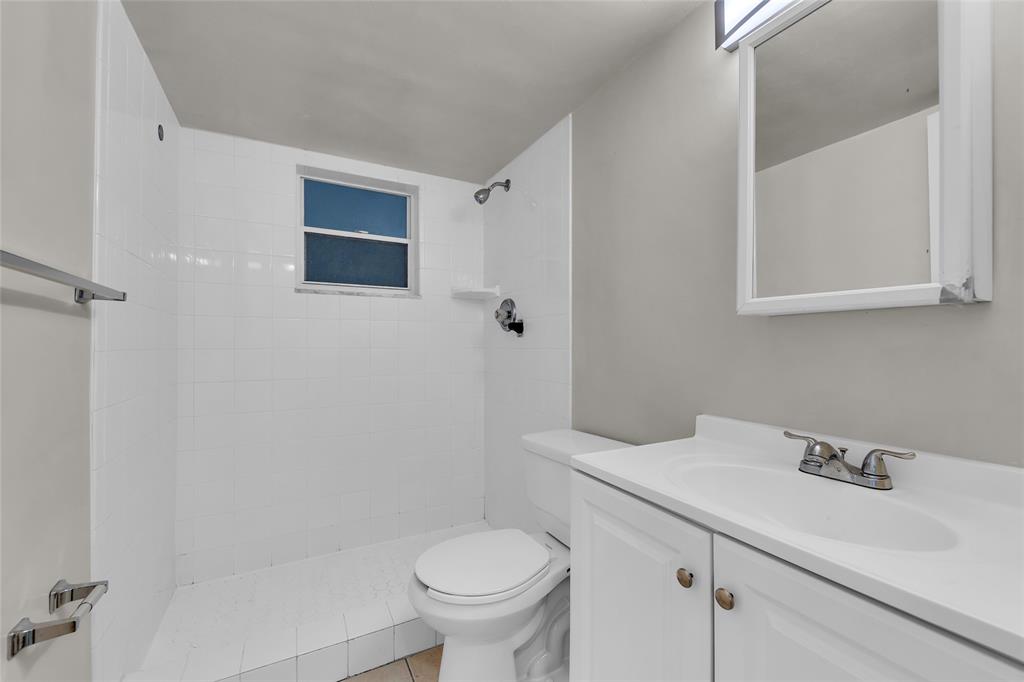 2201 Northeast 36th Street, Unit 205 Lighthouse Point, FL 33064 - Photo 18 of 40 a bathroom with a sink and a toilet