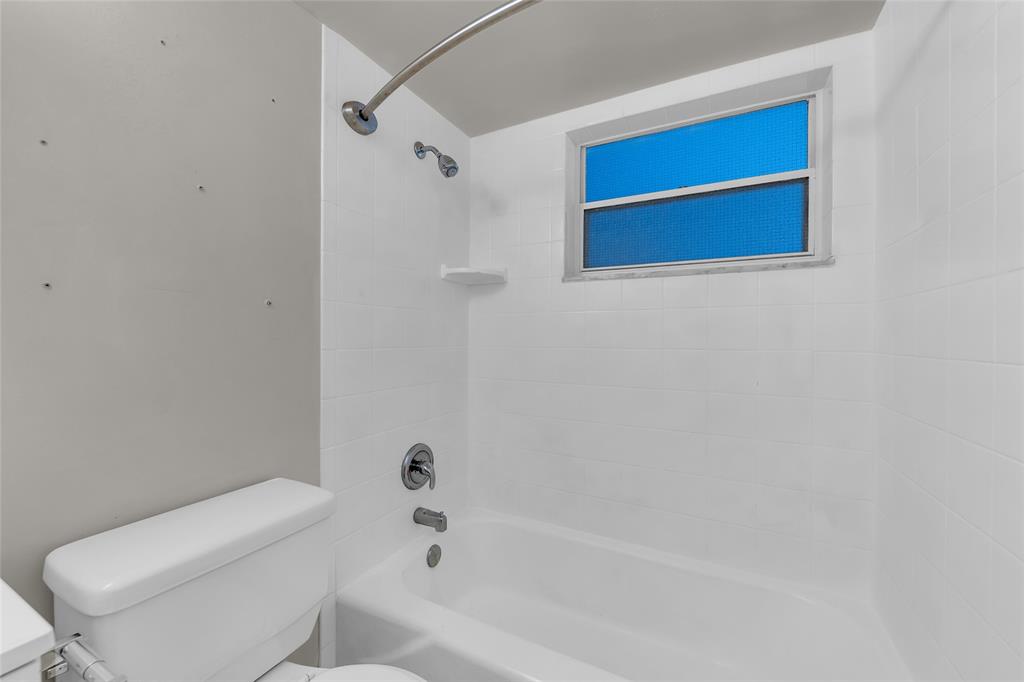 2201 Northeast 36th Street, Unit 205 Lighthouse Point, FL 33064 - Photo 30 of 40 a bathroom with a toilet and a bathtub