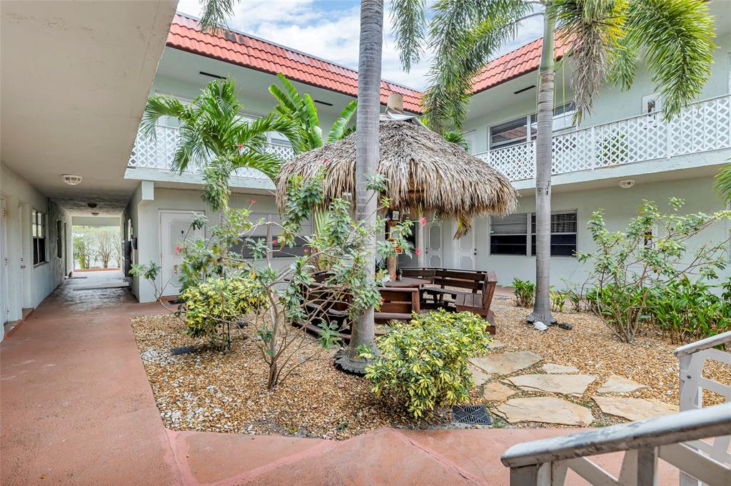 2201 Northeast 36th Street, Unit 205 Lighthouse Point, FL 33064 - Photo 34 of 40 a view of a house with a patio