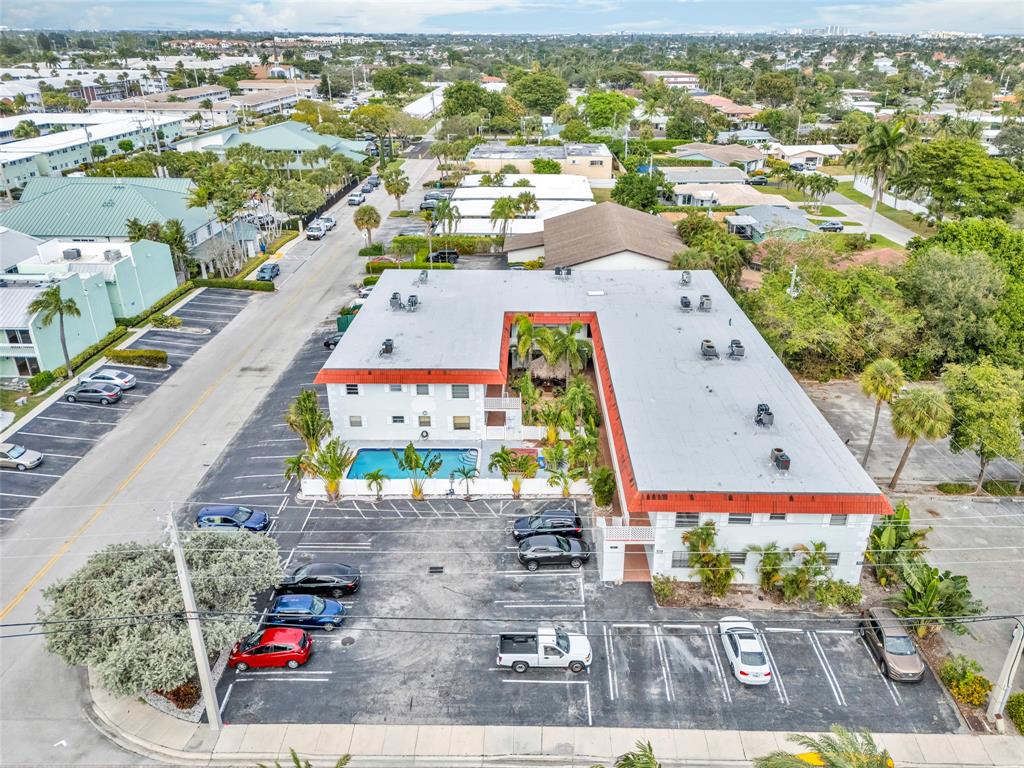 2201 Northeast 36th Street, Unit 205 Lighthouse Point, FL 33064 - Photo 5 of 40 an aerial view of a city with streets and houses