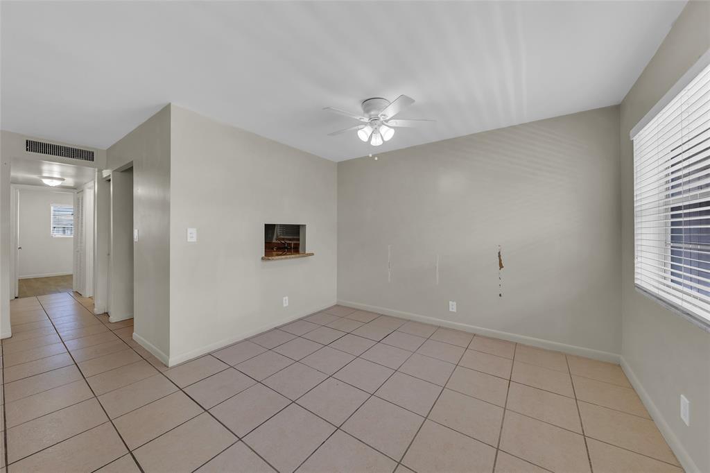 2201 Northeast 36th Street, Unit 205 Lighthouse Point, FL 33064 - Photo 8 of 40 a view of an empty room with a window