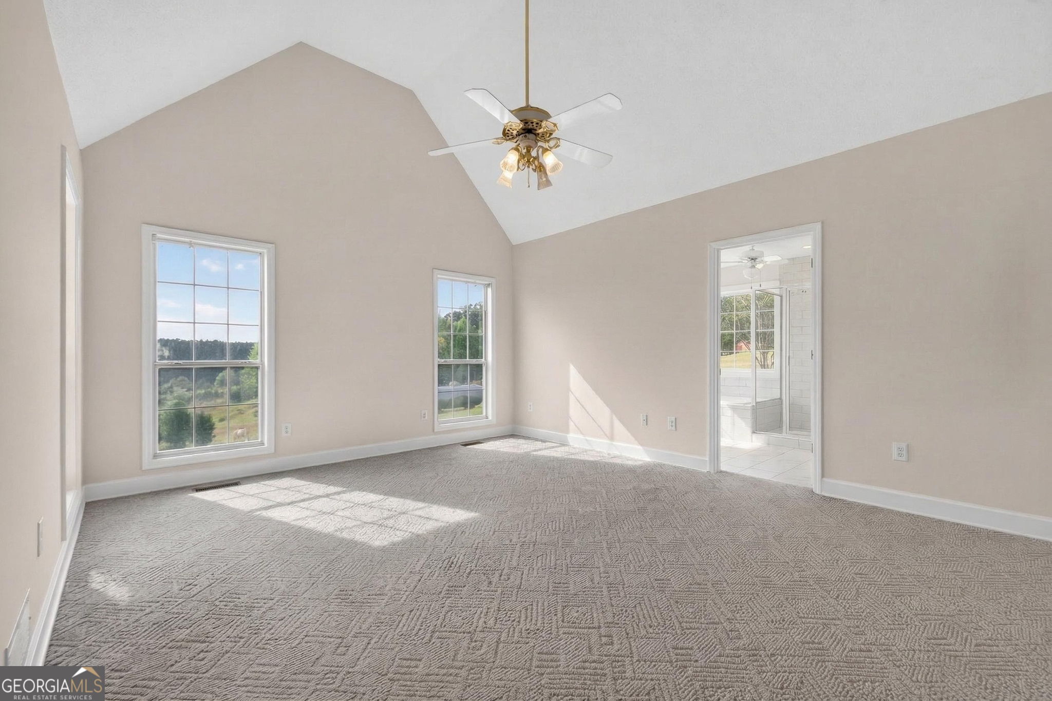955 Mocassin Gap Road Locust Grove, GA 30248 - Photo 18 of 59 a view of a livingroom with a ceiling fan and window