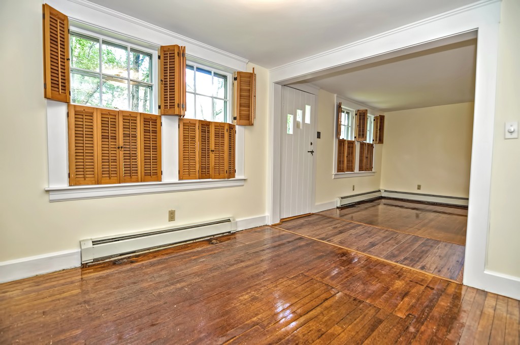 693 Fowler Road Northbridge, MA 01534 - Photo 6 of 25 a view of an empty room with wooden floor and a window