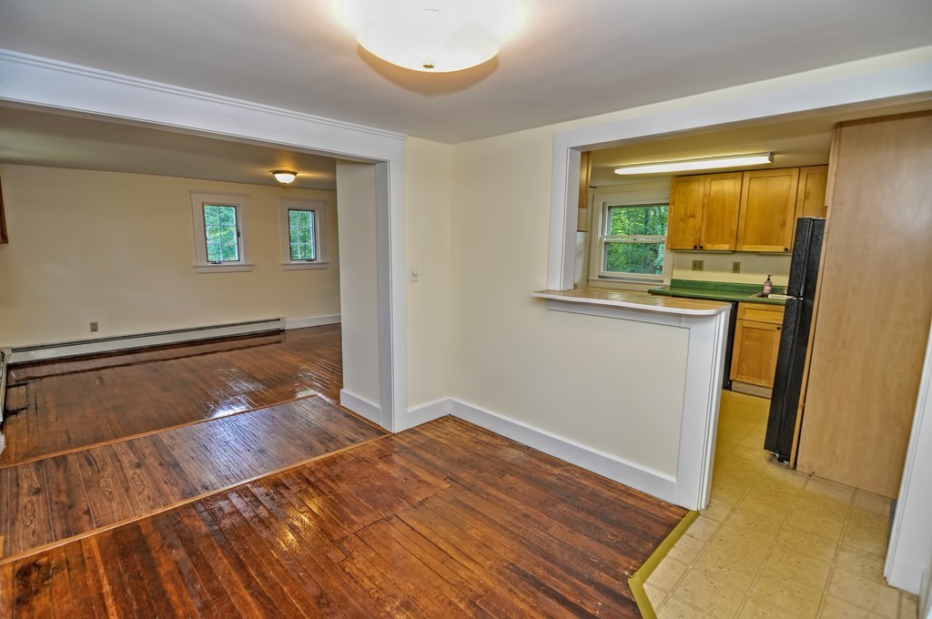 693 Fowler Road Northbridge, MA 01534 - Photo 8 of 25 a view of a room with wooden floor and a window