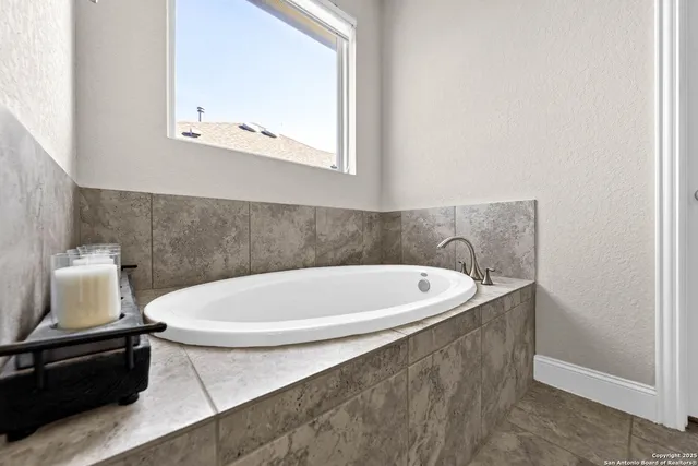 a bath tub sitting in a bathroom
