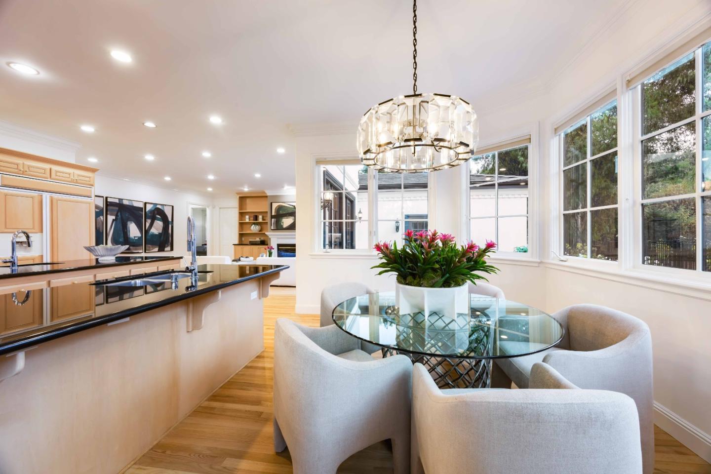 37 Valley Road Atherton, CA 94027 - Photo 12 of 39 a dining room with stainless steel appliances kitchen island furniture and chandelier