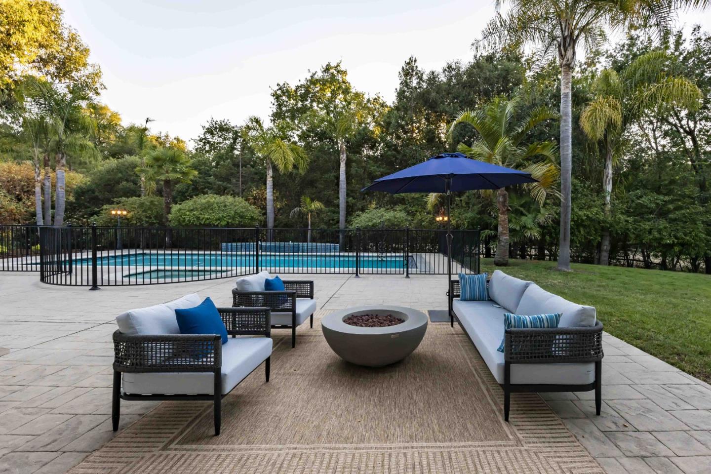 37 Valley Road Atherton, CA 94027 - Photo 34 of 39 a view of a patio with couches chairs and a yard